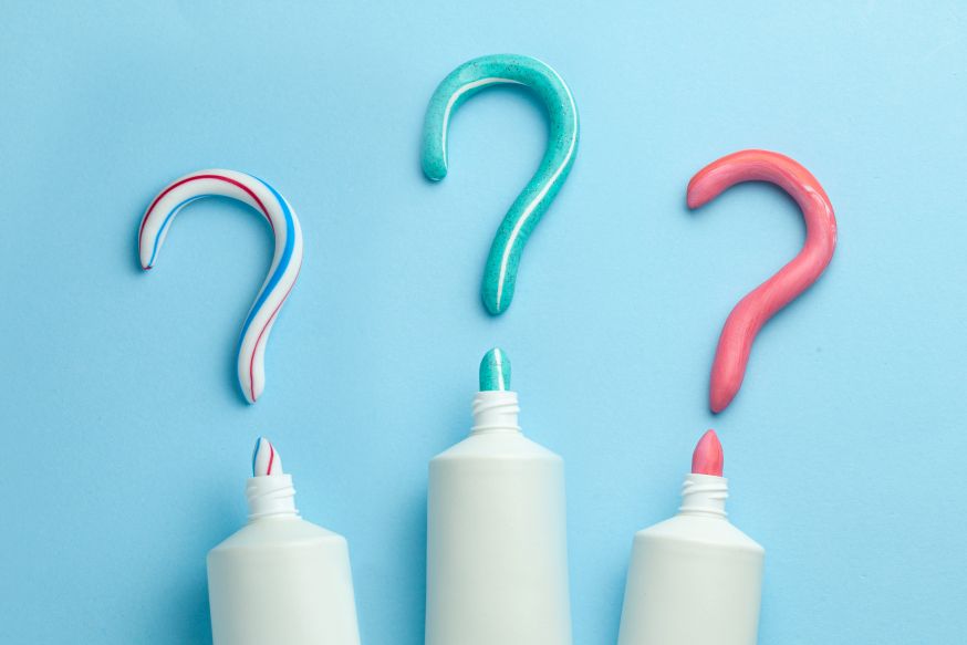 Toothpaste shaped into question marks